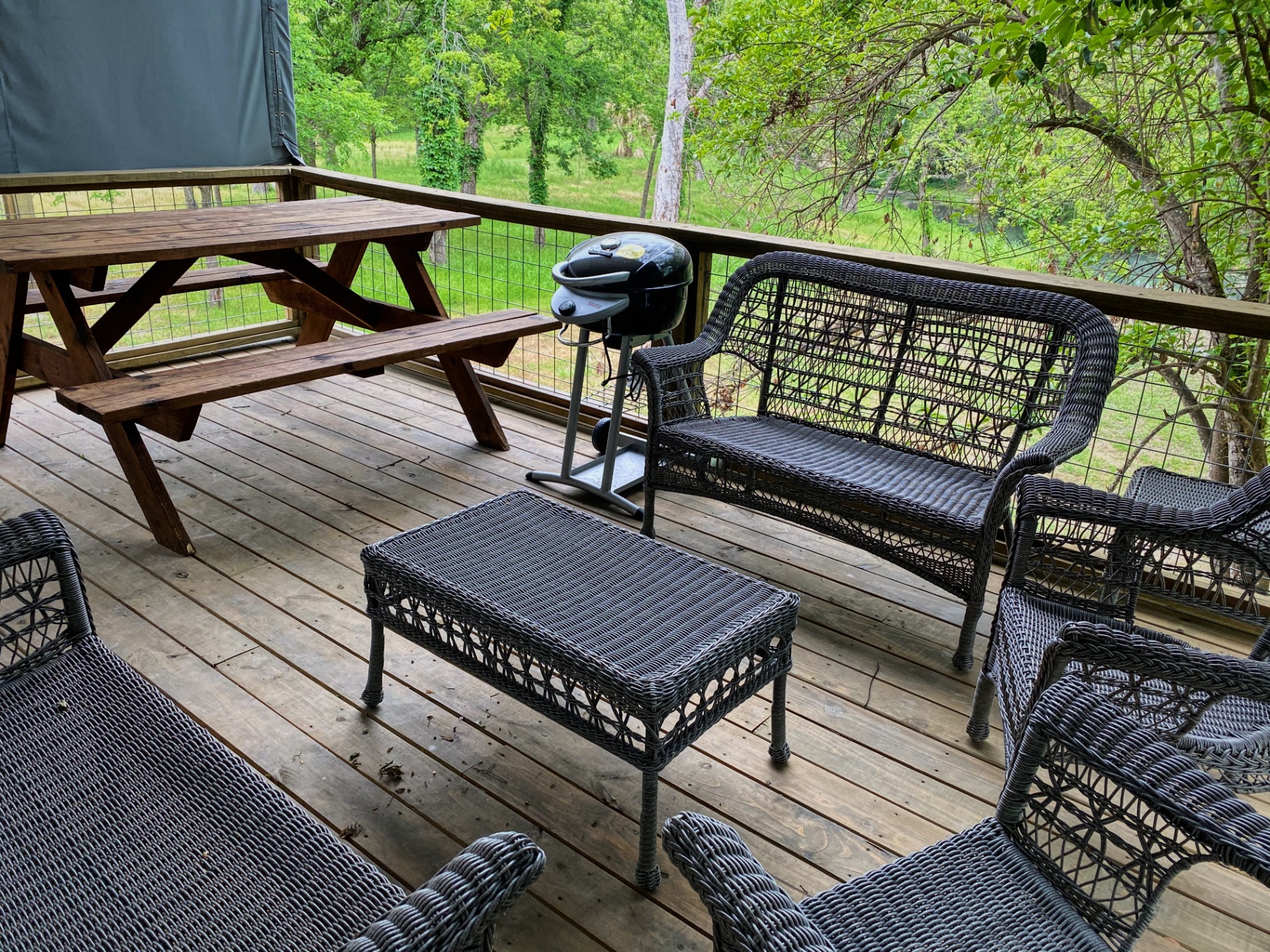 Private cabin deck with seating and grill