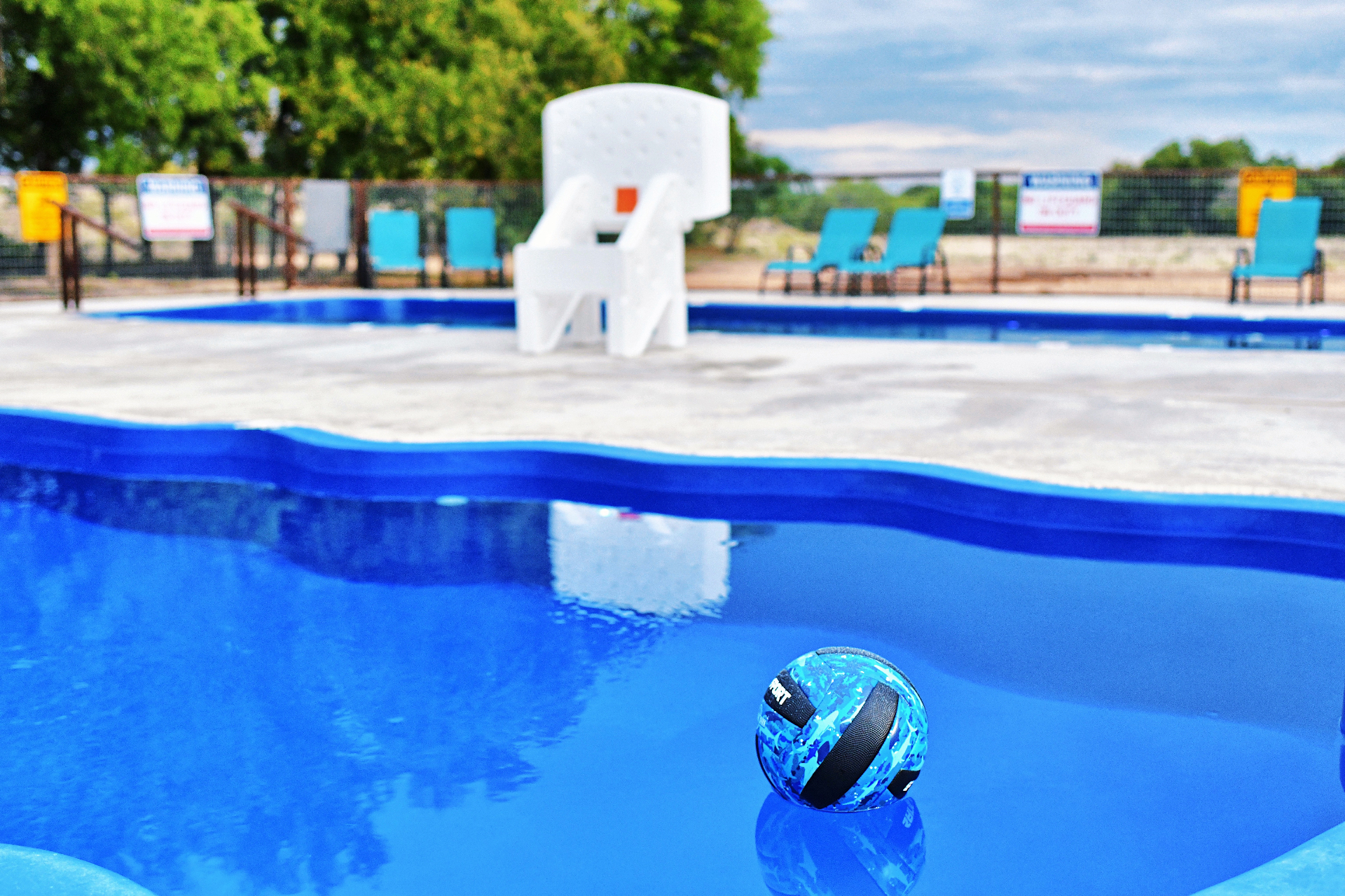 Swimming pool with basketball hoop